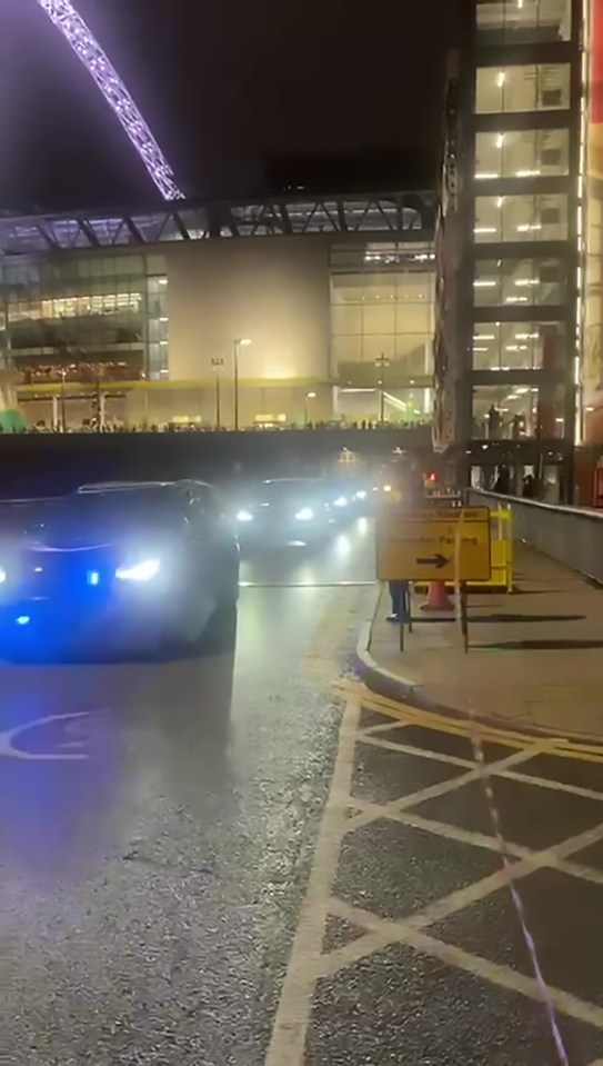 a yellow sign on the side of the road says no parking