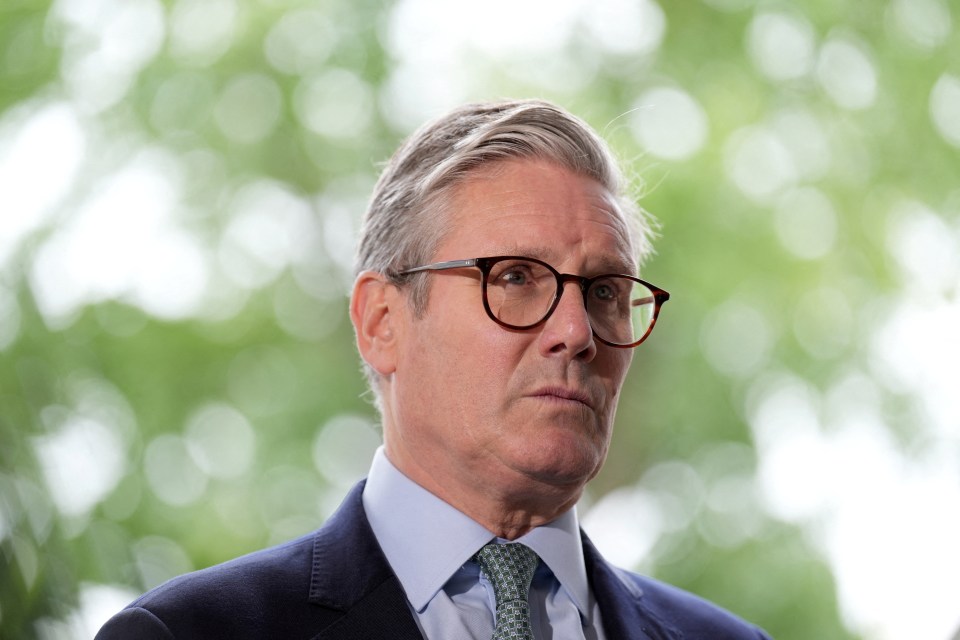 a man in a suit and tie is wearing glasses