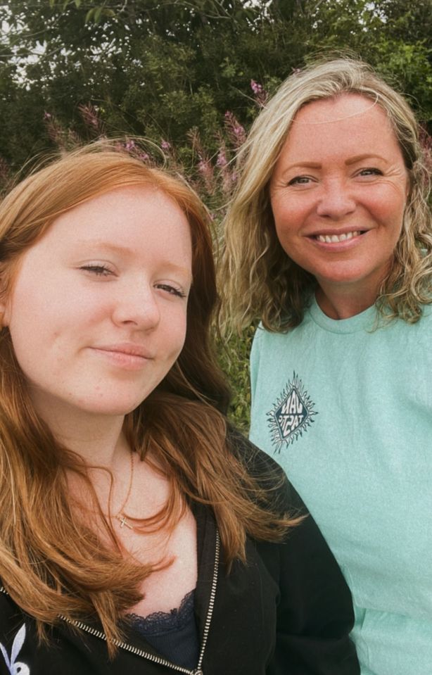 two women standing next to each other with one wearing a shirt that says mad rabbit