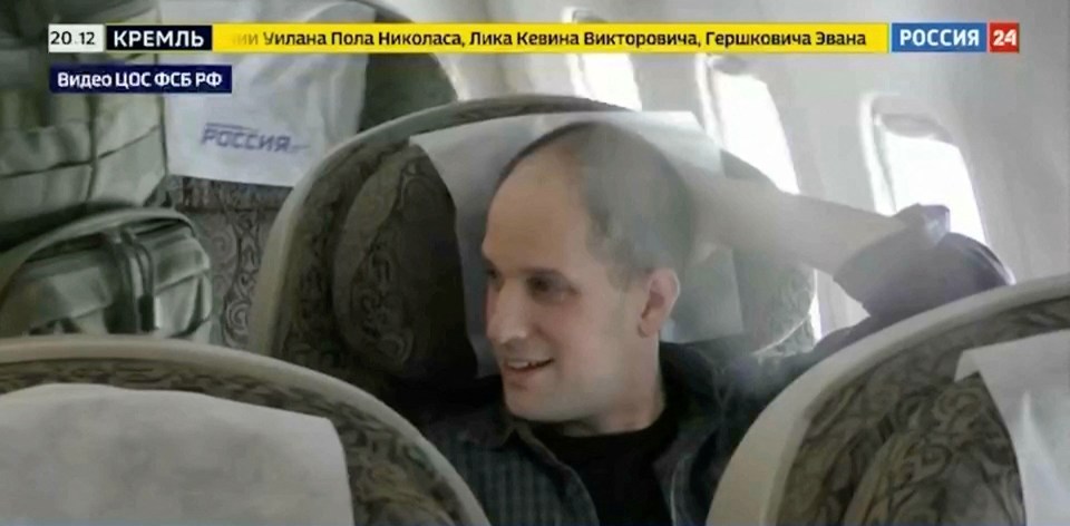U.S. journalist Evan Gershkovich is seen inside a plane during a prisoner exchange between Russia with Western countries at an undisclosed location, in this still image from August 1, 2024 broadcast video. FSB Public Relations Centre/ROSSIYA 24 TV Channel via REUTERS ATTENTION EDITORS - THIS IMAGE HAS BEEN SUPPLIED BY A THIRD PARTY. NO RESALES. NO ARCHIVES. MANDATORY CREDIT. WATERMARK AND TV GRAPHICS FROM SOURCE.