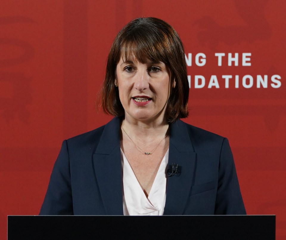 a woman stands at a podium that says fixing the foundations