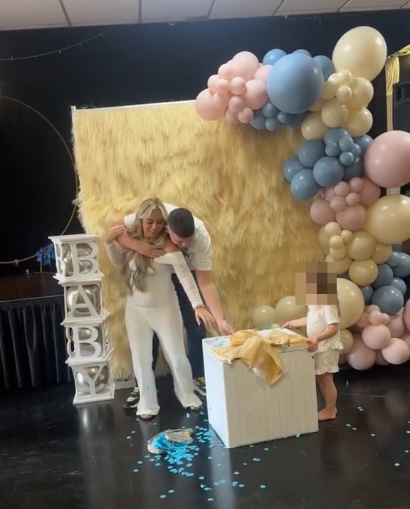 a baby shower with balloons and boxes that say baby