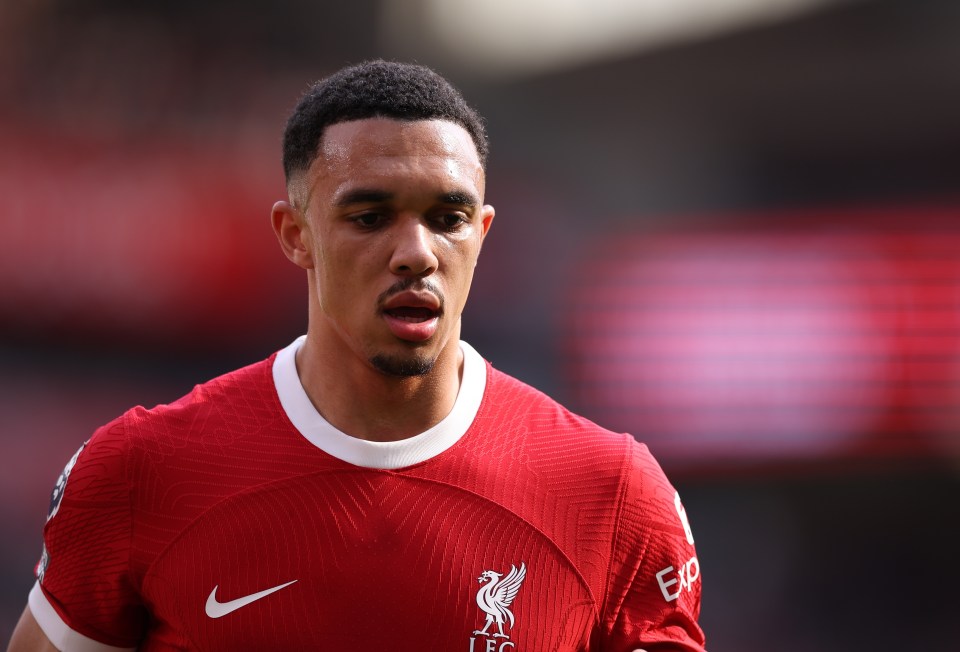 a soccer player wearing a red jersey that says lfc