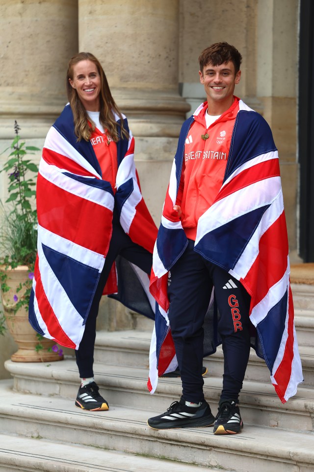 a man and a woman are wrapped in british flags