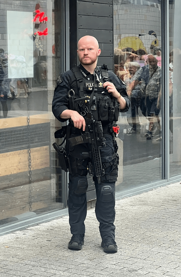 a police officer standing in front of a building