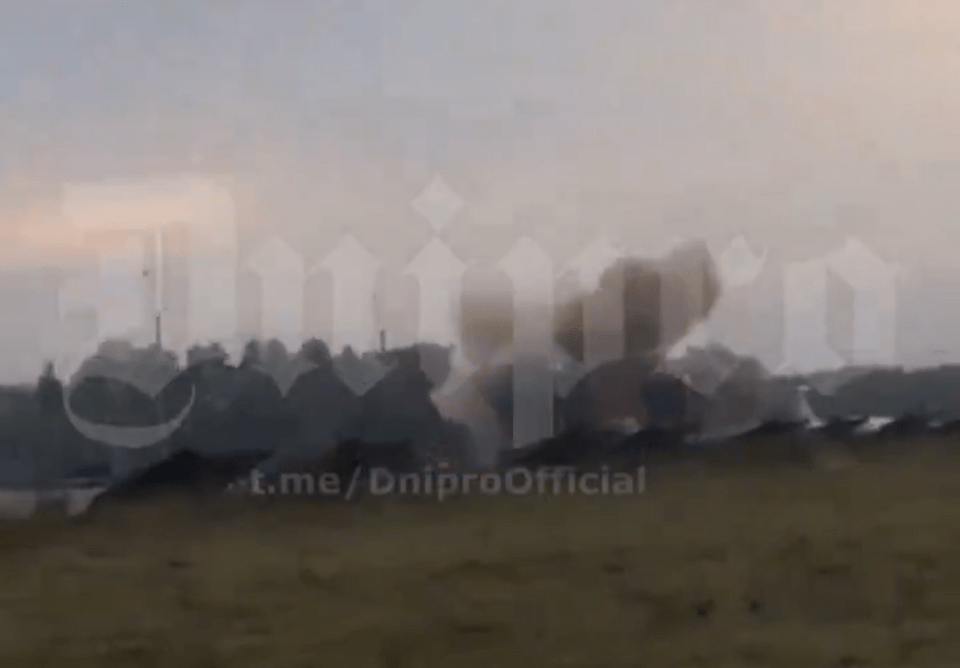 a blurred image of a field with the words dnipro official on the bottom