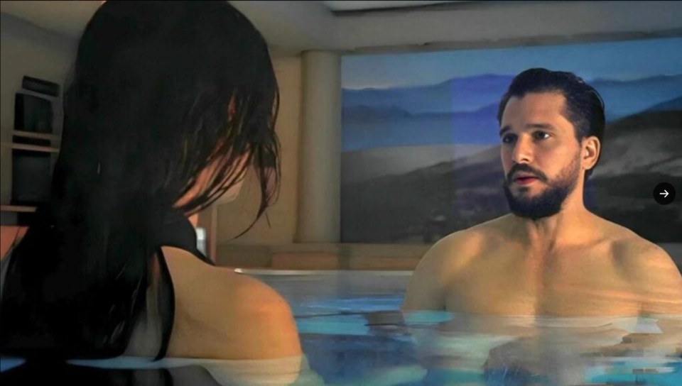 a man with a beard is standing next to a woman in a hot tub