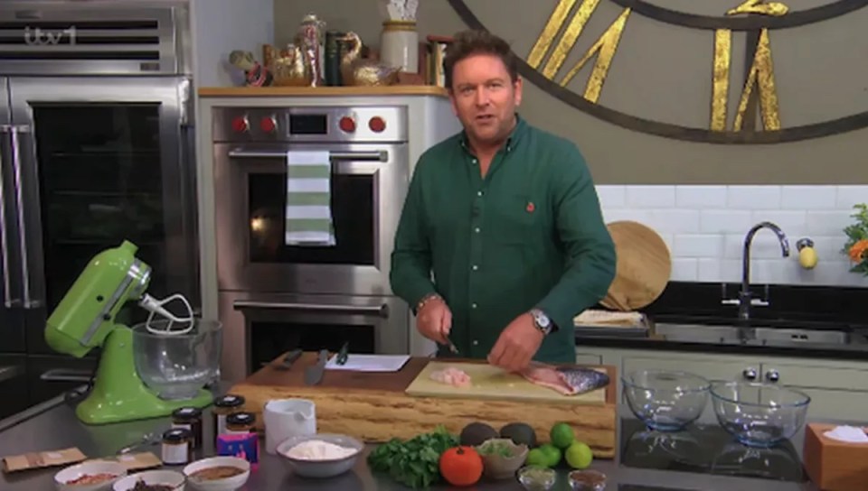 a man in a green shirt is preparing food in a kitchen