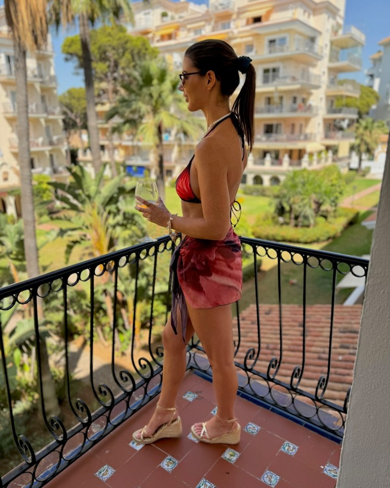 She shared a snap in a sarong after a dip at the beach