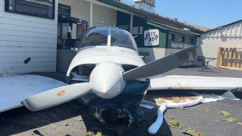 a small plane is parked in front of a building that says jeff 's grip