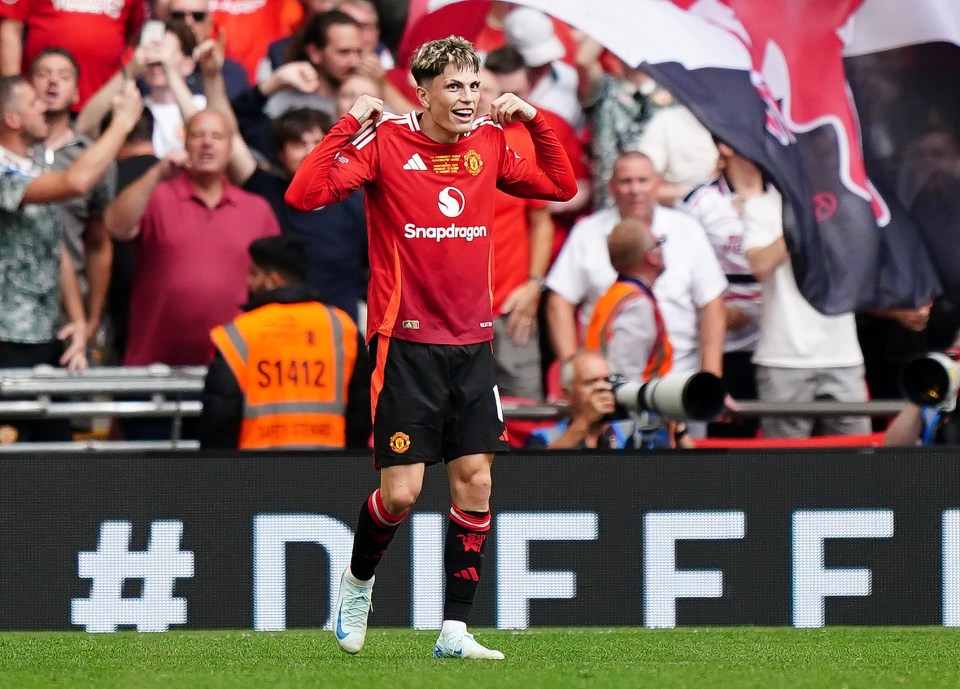 a soccer player wearing a snapdragon jersey celebrates on the field