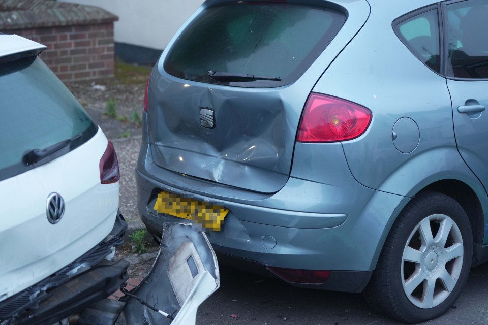 a volkswagen and a seat car are parked next to each other