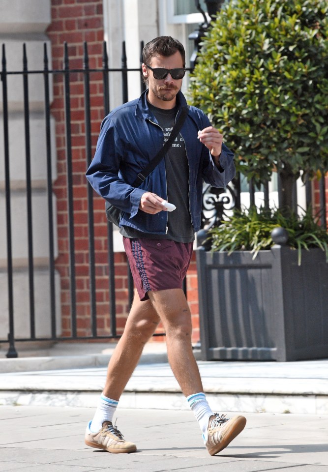 a man wearing shorts with the word adidas on them