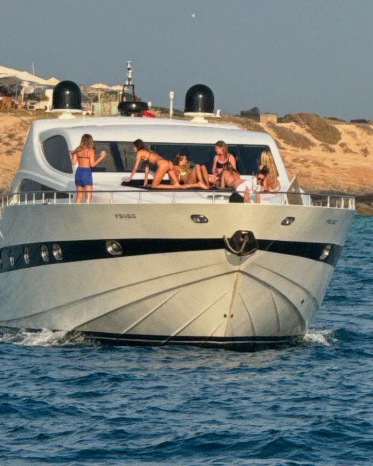 a group of people on a yacht with the letters fb on the front