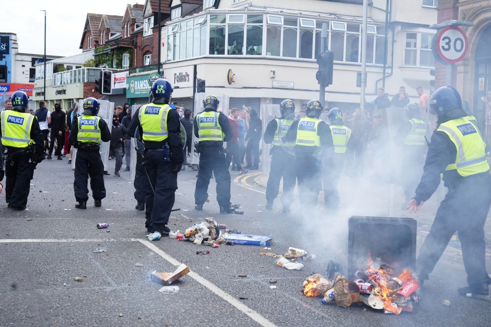 a group of police officers standing on a street