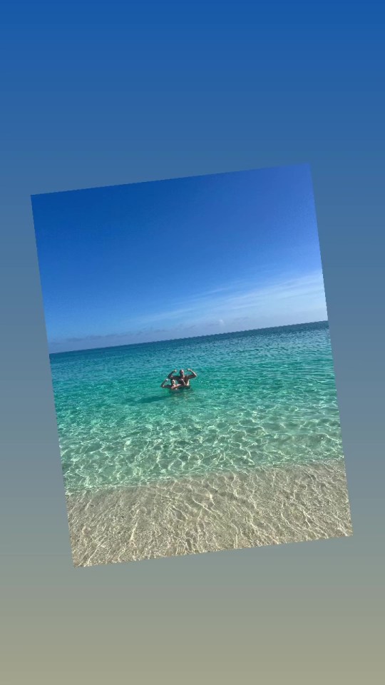 a person is floating on their back in the ocean