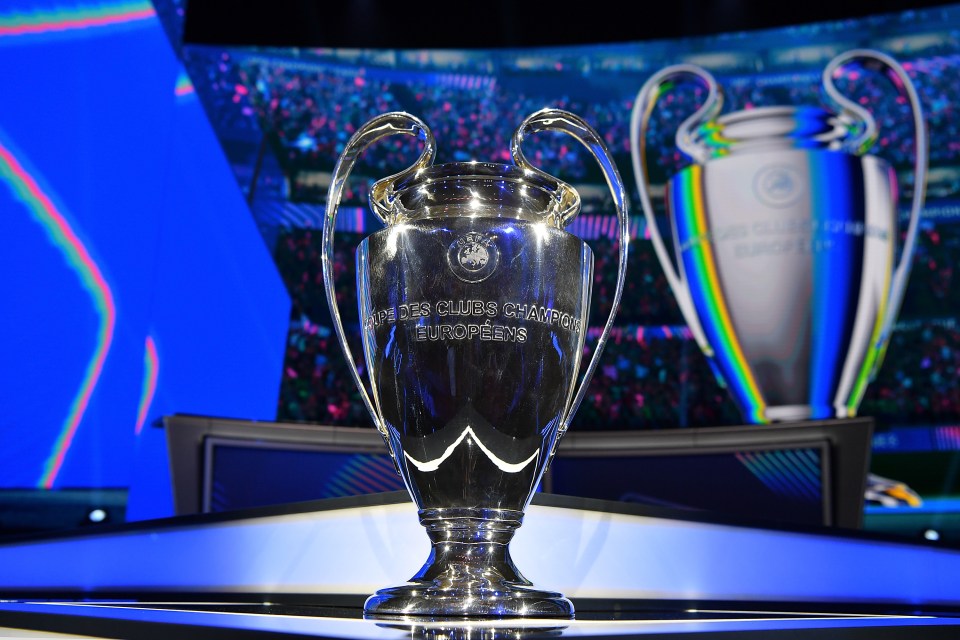 a silver trophy that says ' coupe des clubs champions europeens ' on it