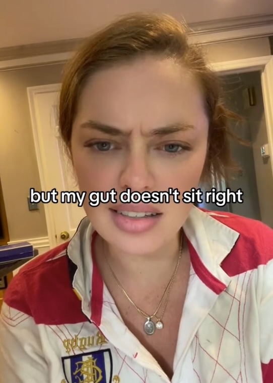 a woman in a red white and blue shirt says but my gut does n't sit right