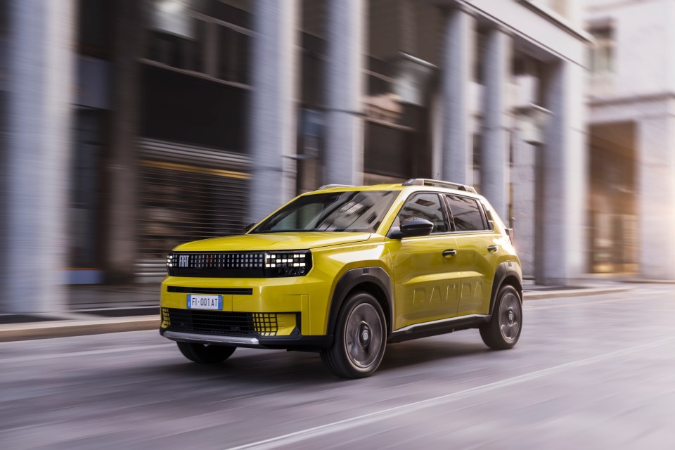 a yellow car with a license plate that says fi-803-lt