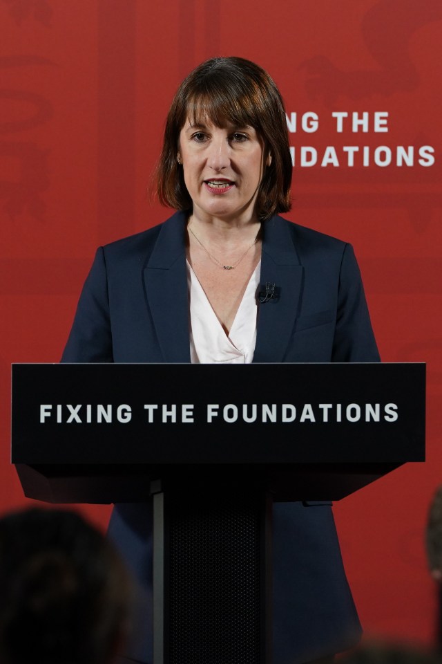 a woman stands at a podium that says fixing the foundations