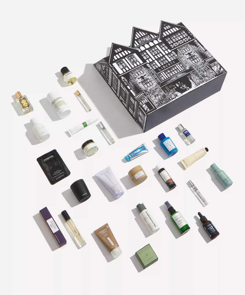 a variety of beauty products are laid out on a white surface