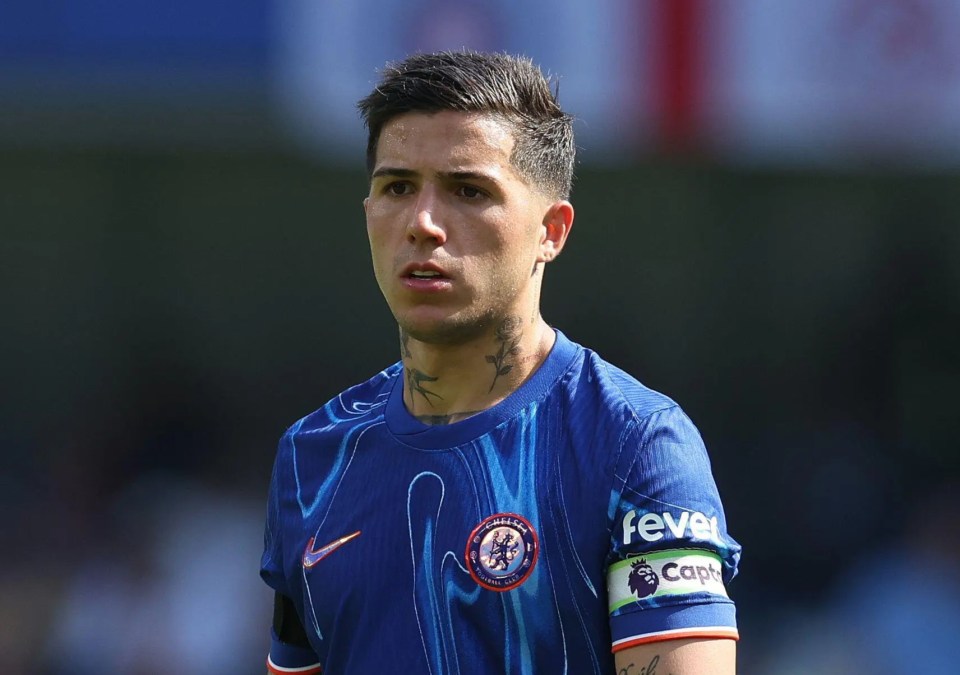 soccer player wearing a blue shirt that says fever on it
