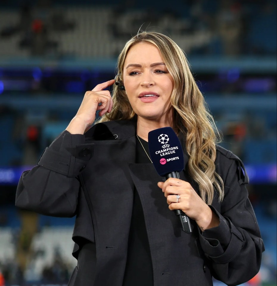 a woman holding a microphone that says champions league on it
