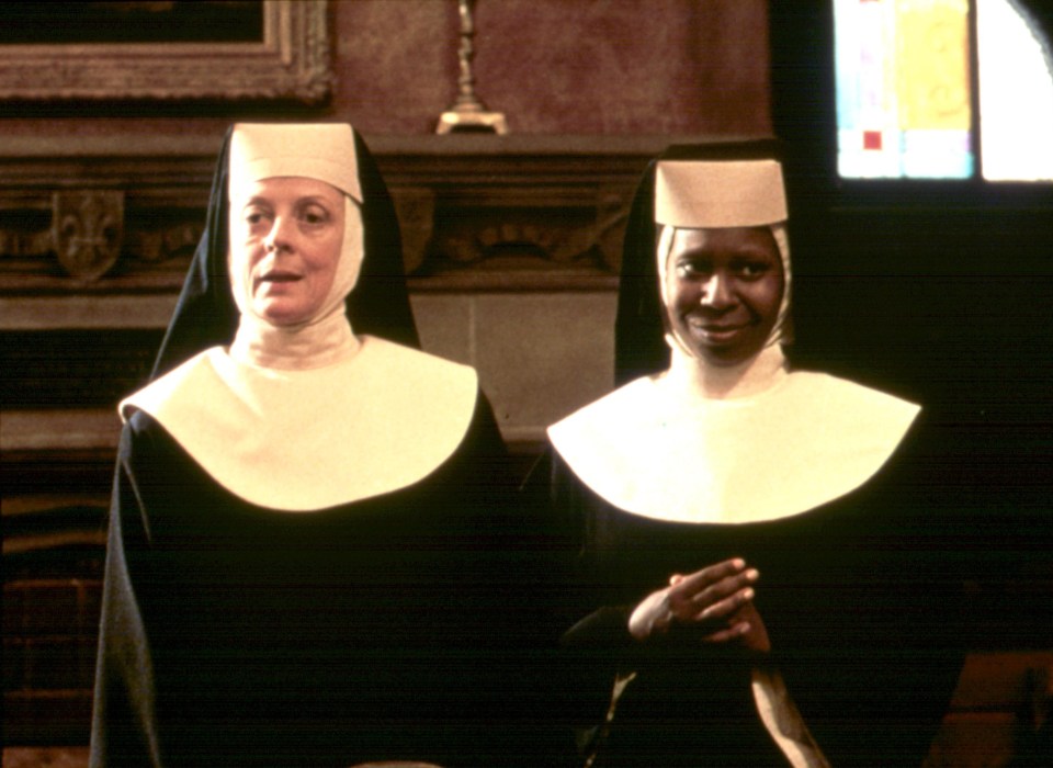 two nuns are standing next to each other in a church