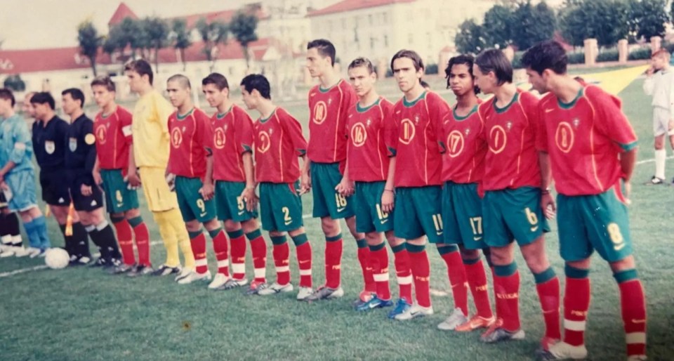 a group of soccer players are lined up on a field and one has the number 17 on his jersey