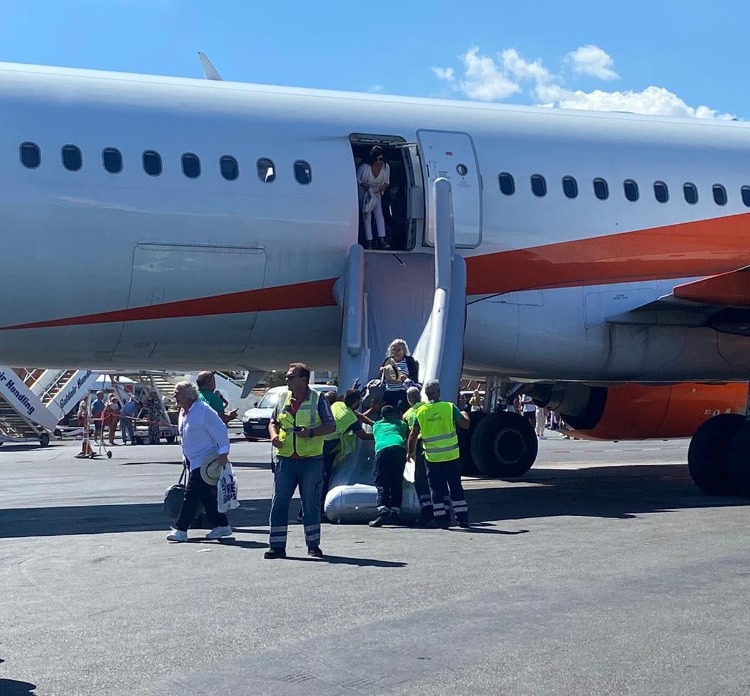 Panicked passengers evacuated the plane after the explosion