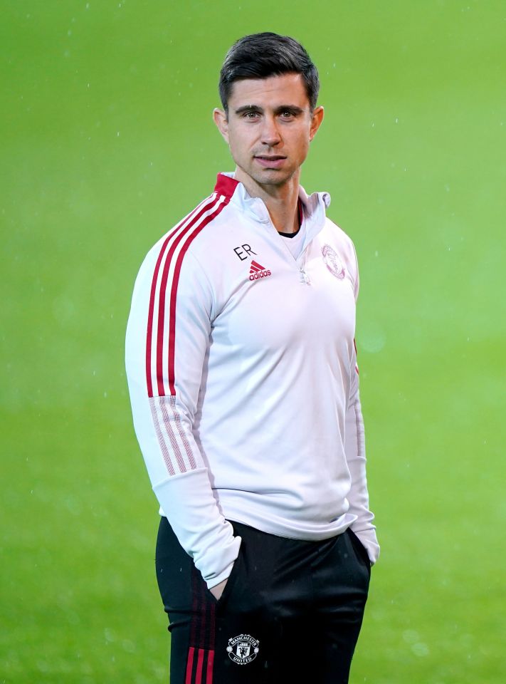 a man wearing a white adidas shirt with red stripes