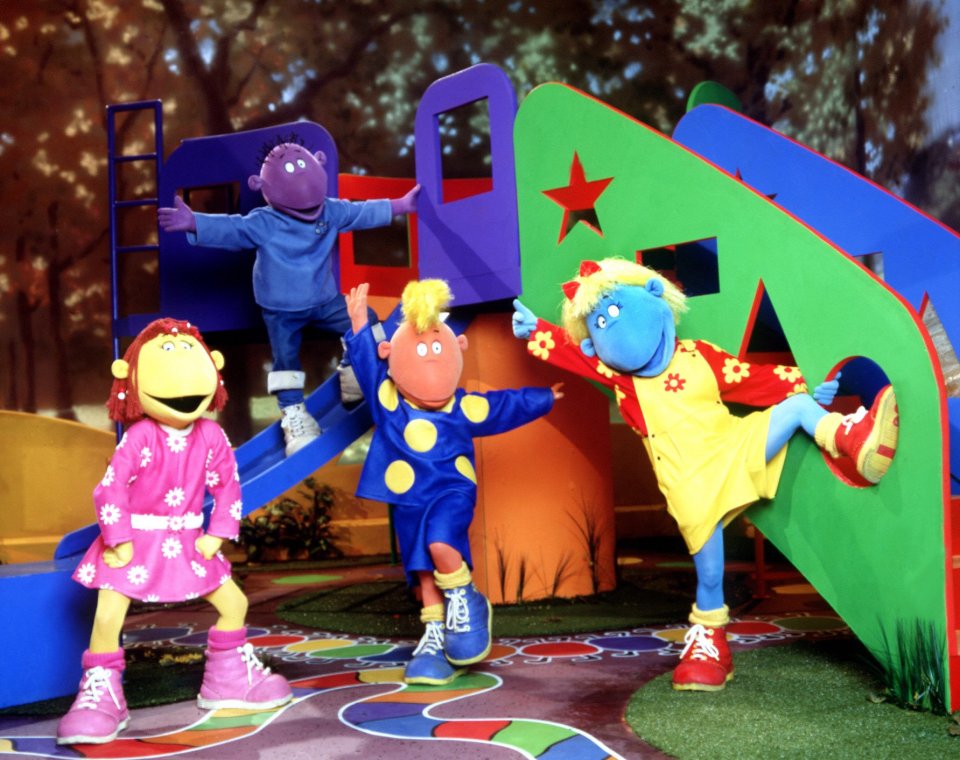 a group of cartoon characters are playing in a playground