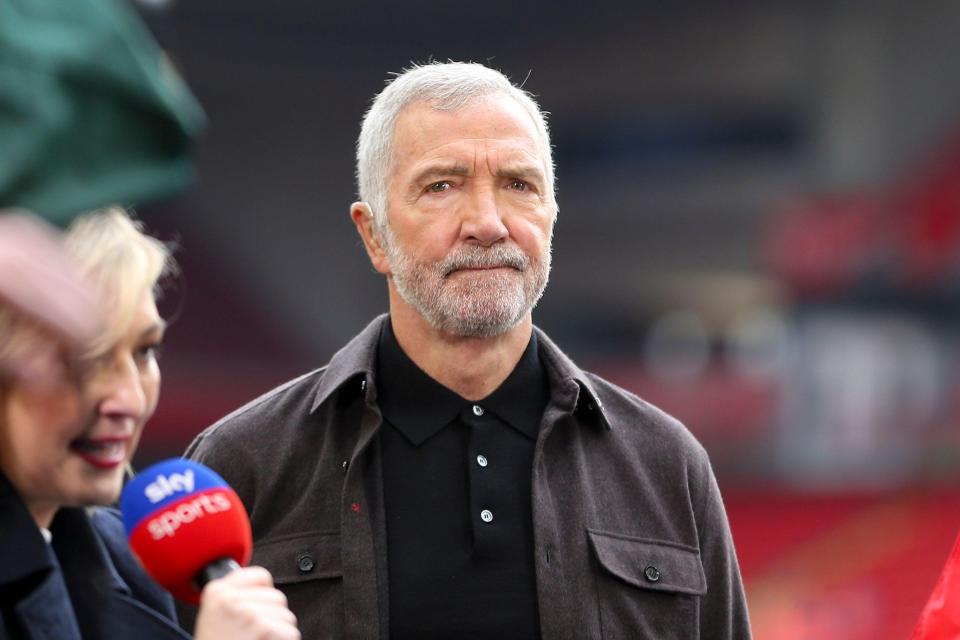 a man holding a microphone that says sky sports