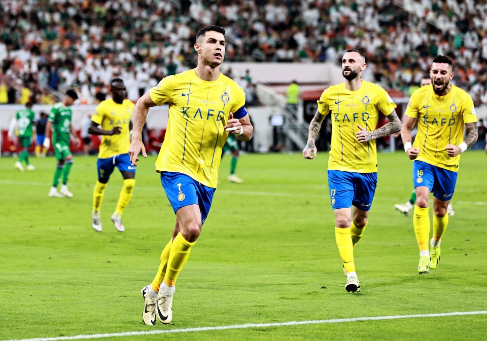 a soccer player wearing a yellow kaff jersey runs on the field