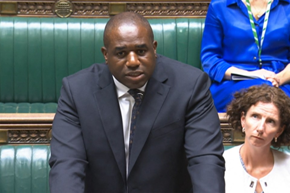 a man in a suit and tie is giving a speech