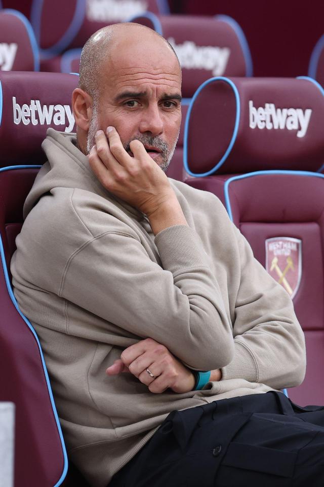 a man sits in a row of betting seats
