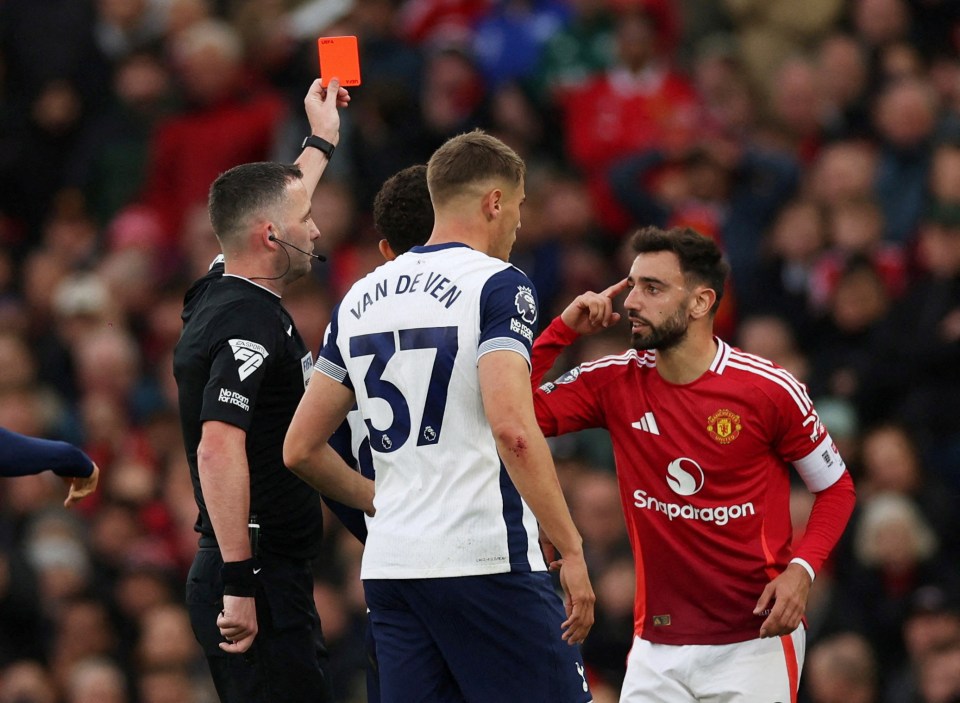 a man in a van de ven jersey is getting a red card