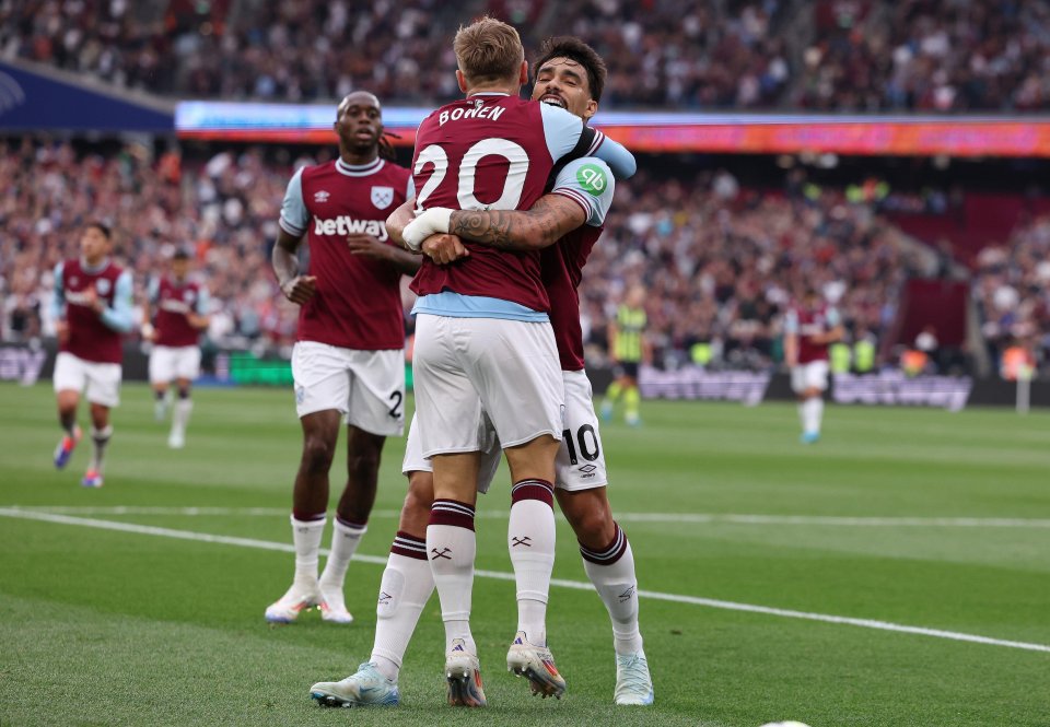 player number 20 is hugging another player on the field