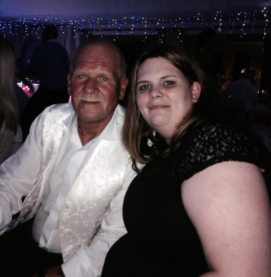 a man in a white vest sits next to a woman in a black dress