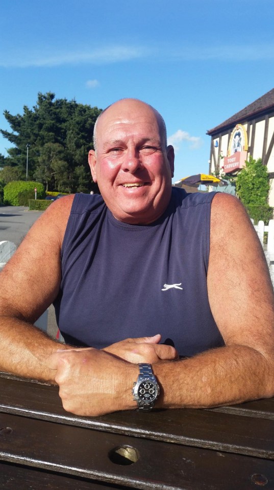 a man wearing a sleeveless shirt with a slazenger logo on it