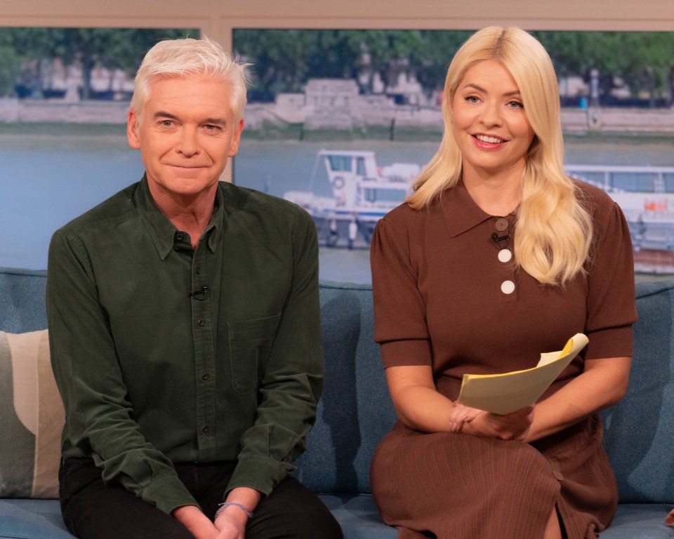 a man and a woman are sitting next to each other on a couch
