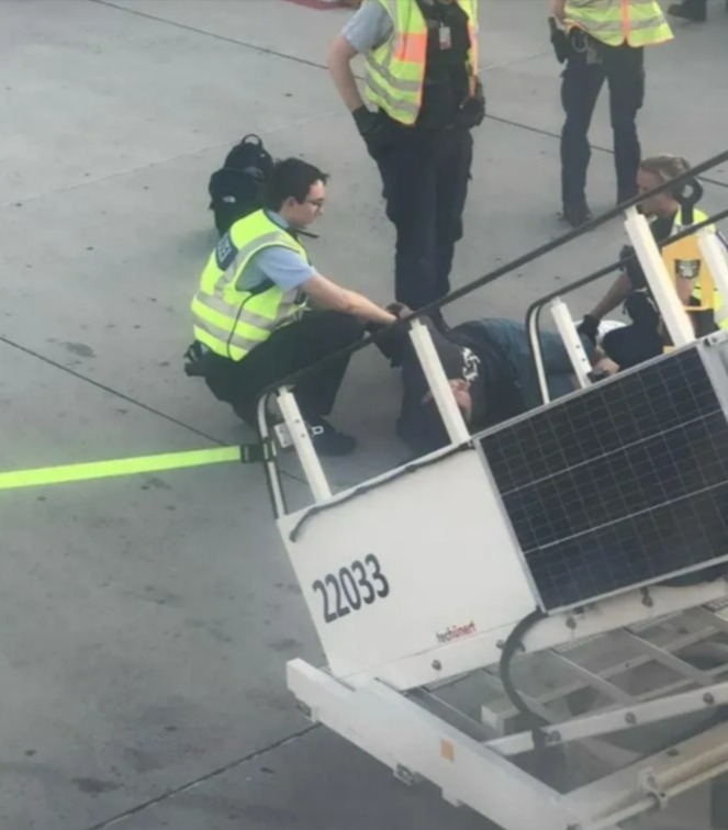 a man laying on a staircase with the number 22033 on it
