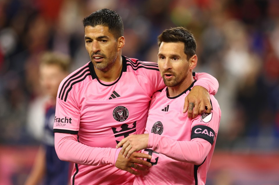 two soccer players wearing pink shirts that say racht group