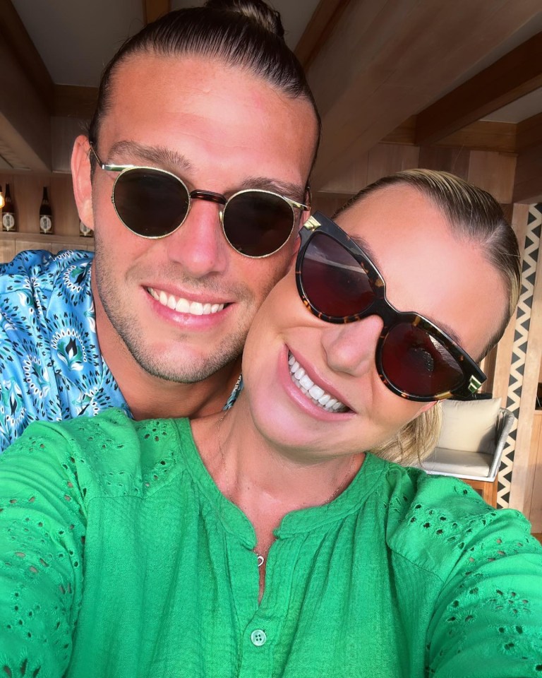 a man and a woman wearing sunglasses are posing for a picture