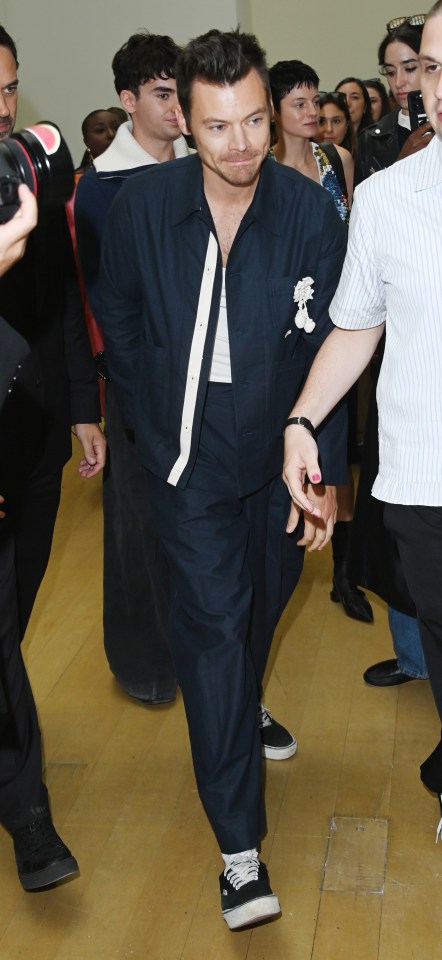 a man wearing a white shirt with the word ida on it