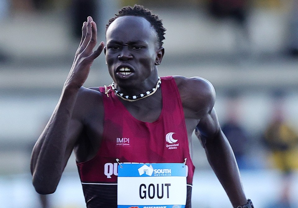 a runner named gout is running on a track