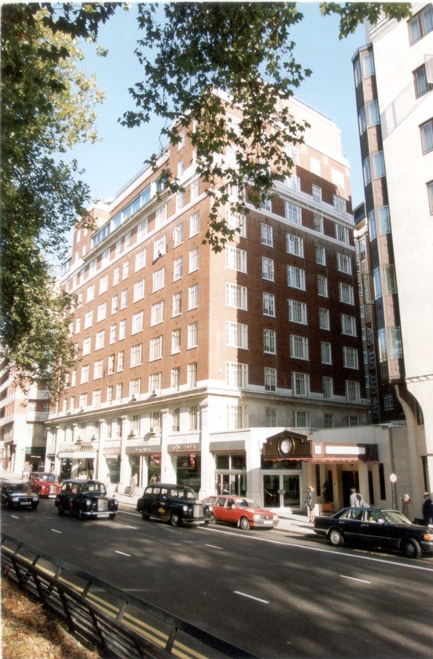 a large brick building with a sign that says ' the plaza ' on it