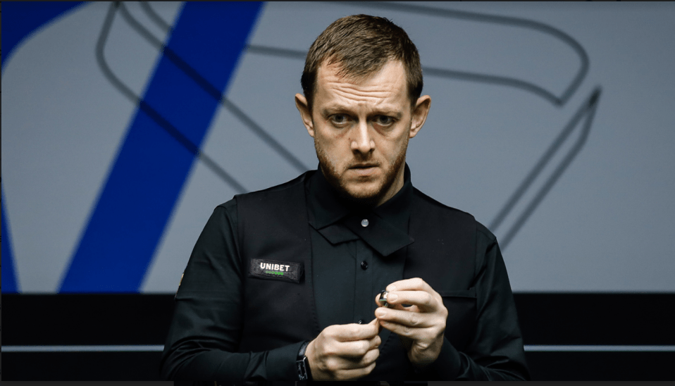 a man wearing a shirt that says ' unibet ' on it