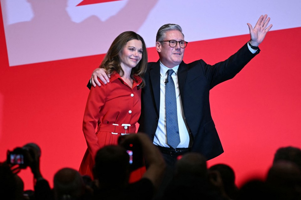 Britain's Prime Minister Keir Starmer stands with his wife Victoria as he acknowledges the applause after delivering his keynote speech on the third day of the annual Labour Party conference in Liverpool, north-west England, on September 24, 2024. (Photo by Paul ELLIS / AFP) (Photo by PAUL ELLIS/AFP via Getty Images)