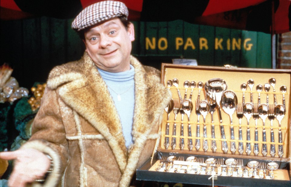 a man stands in front of a no parking sign
